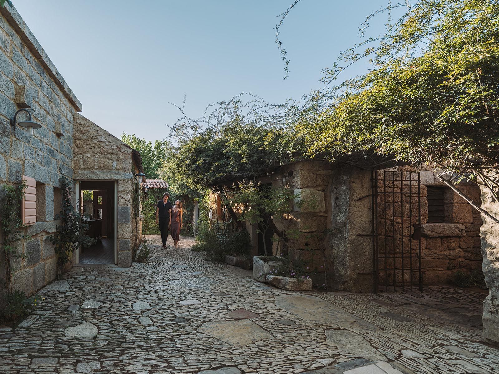 Amadria Park Dalmatian Ethno Village — stone-paved alley between traditional Dalmatian houses