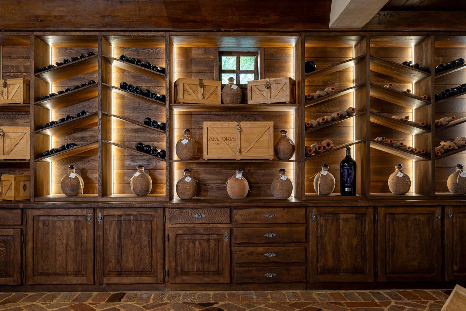Amadria Park Dalmatian Ethno Village wine cellar — vaulted stone interior with wooden barrels