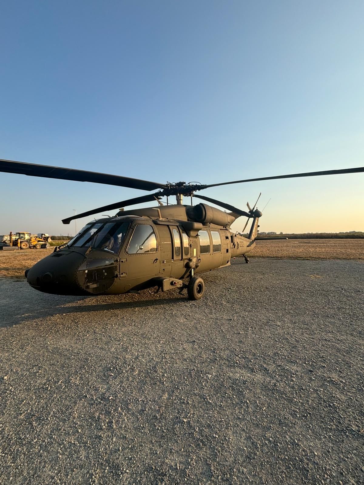 Sikorsky UH-60 Black Hawk helicopter on static display at golden hour during DEFCROS