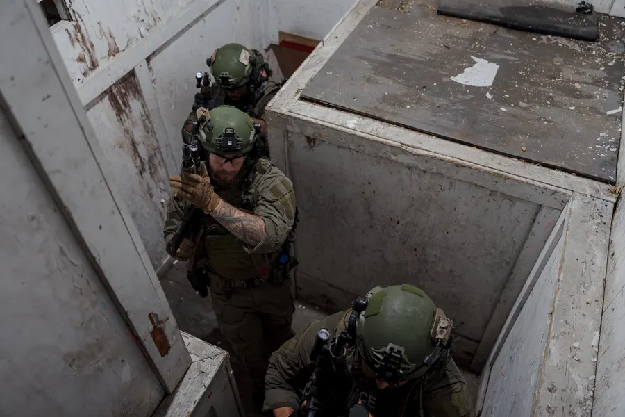 Operators clearing a room during close-quarters training