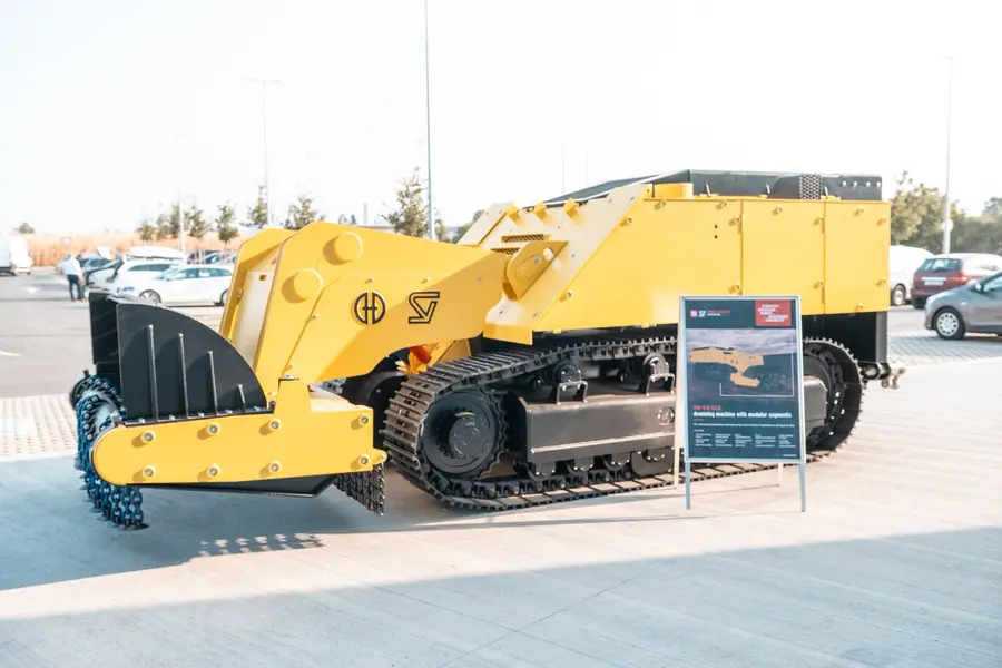 Yellow tracked demining machine on the outdoor display