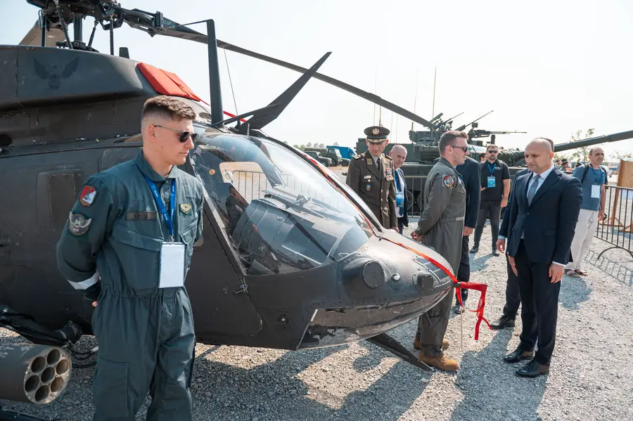 Helicopter pilot standing by his aircraft on the outdoor static display
