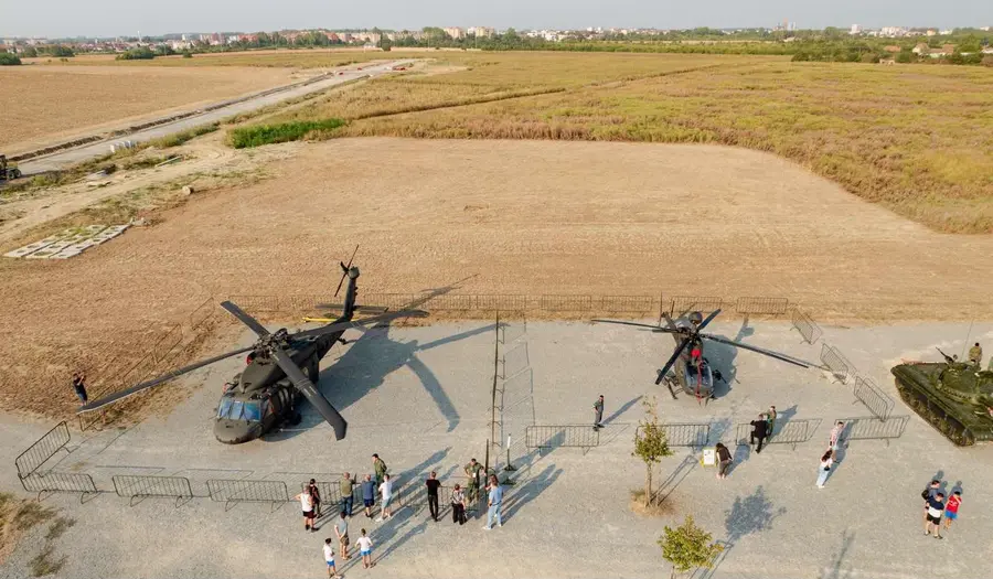 Aerial view of helicopters and visitors on the outdoor static display