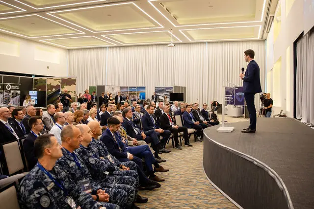 Croatian Navy officers in the audience of a full hall