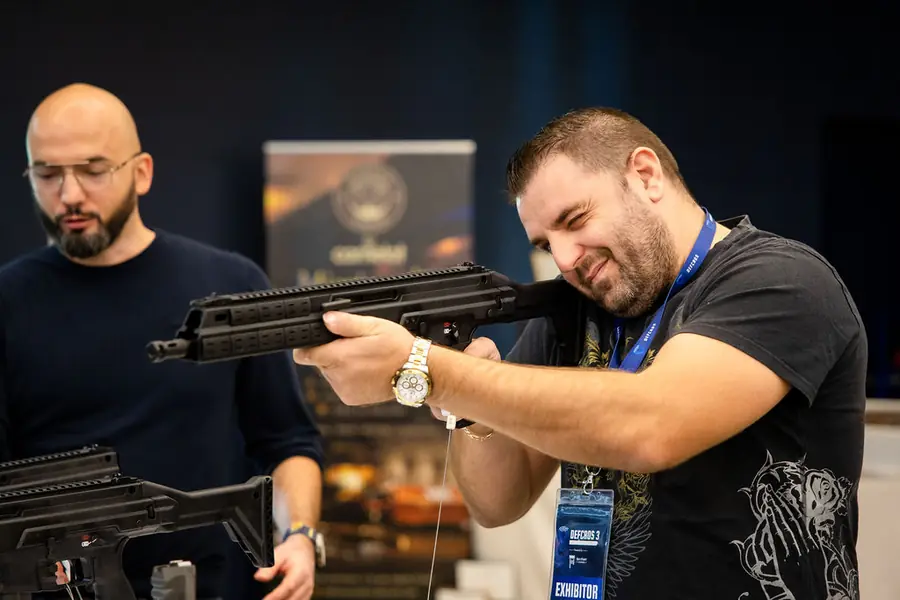 Visitors handling rifles at the HS Produkt stand