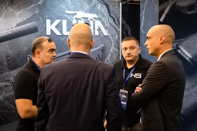 Exhibitors talking at the KUNA stand