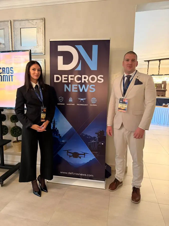 Hosts at the DEFCROS News stand