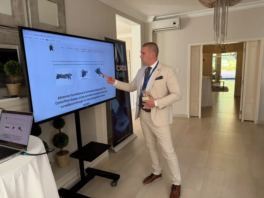 Speaker presenting on screen during the summit